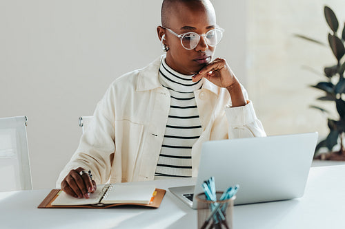 Professional woman focused on work at her laptop