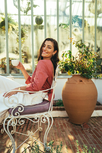 Smiling young tourist woman relaxing outdoors