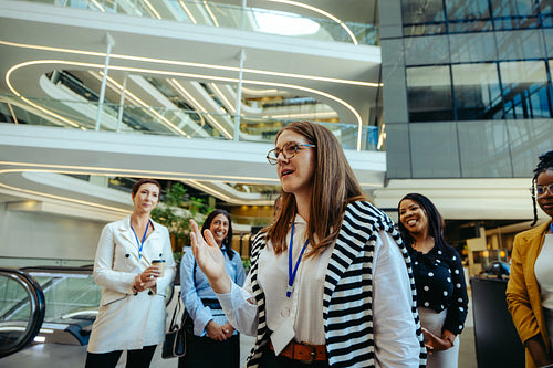 Professional women networking in a modern corporate building