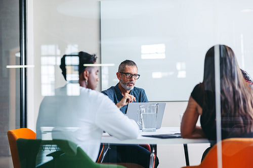 Group of businesspeople having a discussion in a meeting room