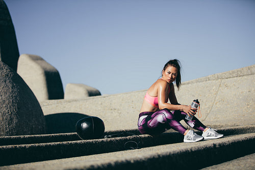 Fitness woman taking a break after exercise session