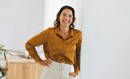 Executive woman smiling confidently in the workplace