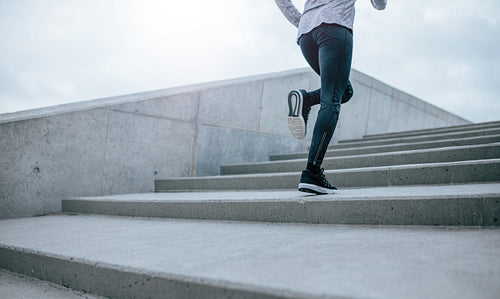 Woman running up the stair