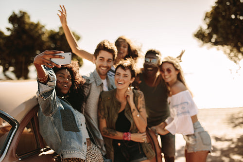 Friends taking selfie on road trip