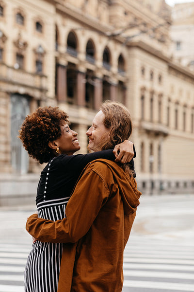 Affectionate embrace on a city walk, love and togetherness outdoors
