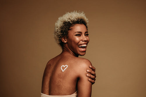 Rear view of laughing african american woman