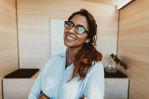 Smiling businesswoman with eyeglasses in office