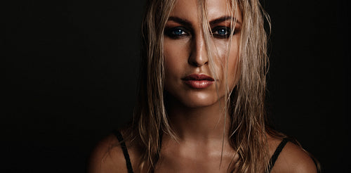 Beautiful young woman with wet look makeup