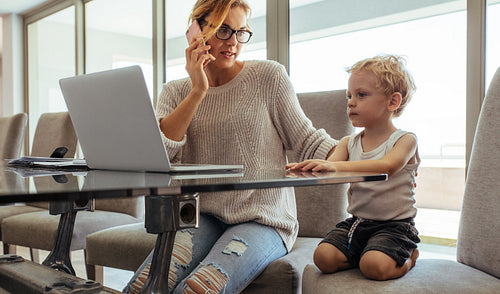 Mother with son working from home