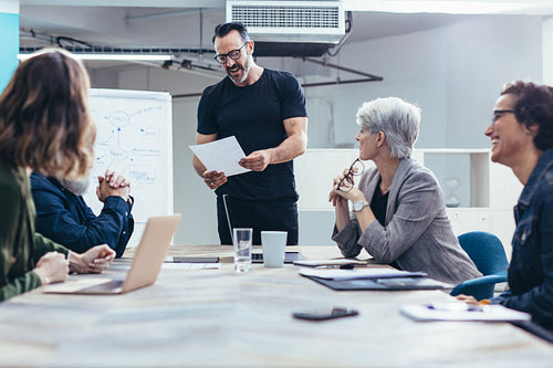 Entrepreneur sharing the project details with team