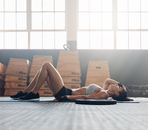 Fitness woman relaxing after exercise session