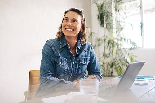 Thoughtful businesswoman working at her office desk