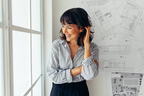 Portrait of cheerful woman architect