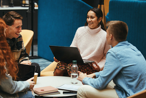 Girl smiling with friends in college campus