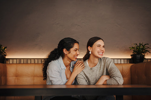 Friends having a great time meeting in a cafe