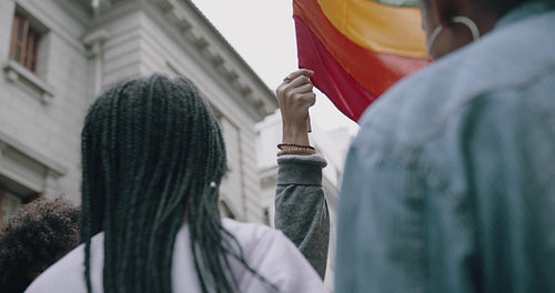 Women waving rainbow flag at Gay pride march