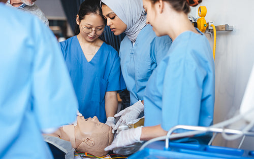 Medical simulation training: Nursing students learn how to do cpr using a medical simulator