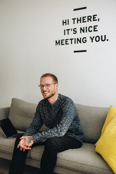 Business executive relaxing on sofa in lobby