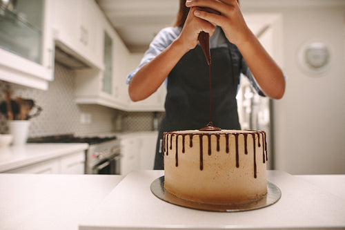 Pastry chef making a delicious cake