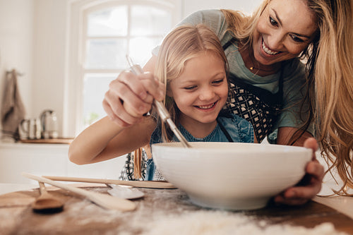 Young family cooking in kitchen