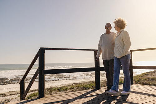 Mature couple taking a stroll at the beach