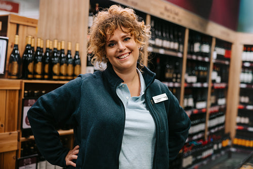 Confident liquor store employee