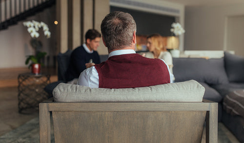 Psychologist with couple talking in background