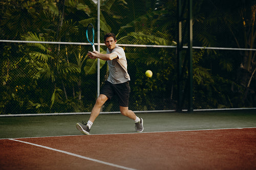 Tennis player enjoying a game at a resort