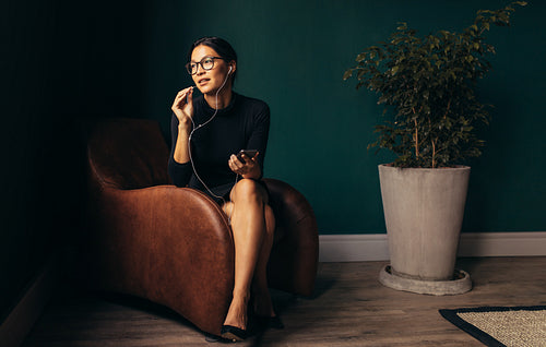 Beautiful young businesswoman talking on phone