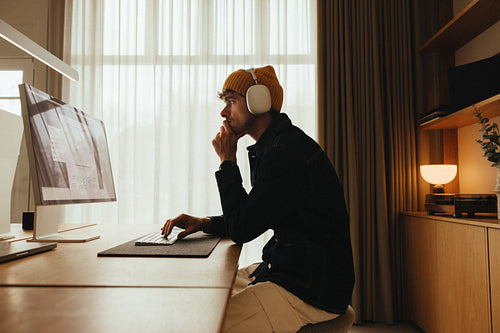 Office productivity: man doing computer work in a modern workspace