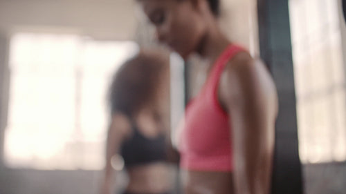 Female taking break after exercising in gym