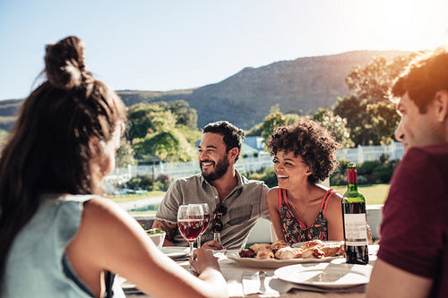 Group of people enjoying outdoor summer meal