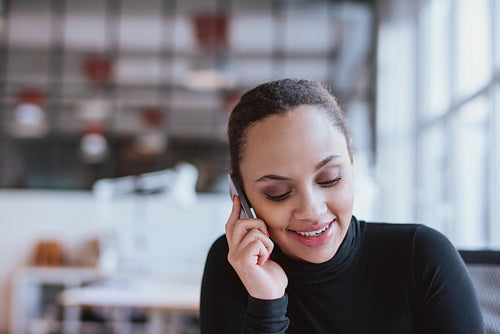 Young woman talking on mobile phone