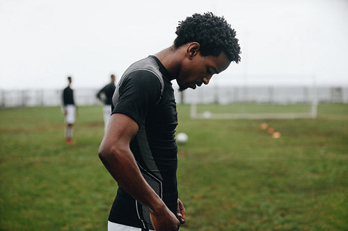 Close up of a soccer player standing on field
