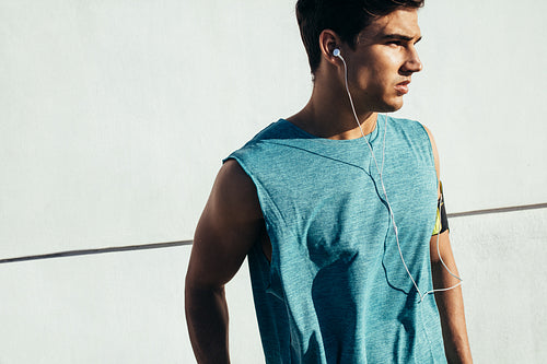 Fit young male relaxing after exercise