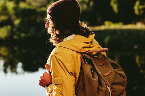 Rear view of a man wearing a backpack