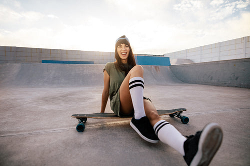 Female skater having fun at skate park