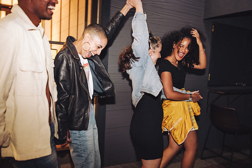 Multicultural friends having fun together outdoors