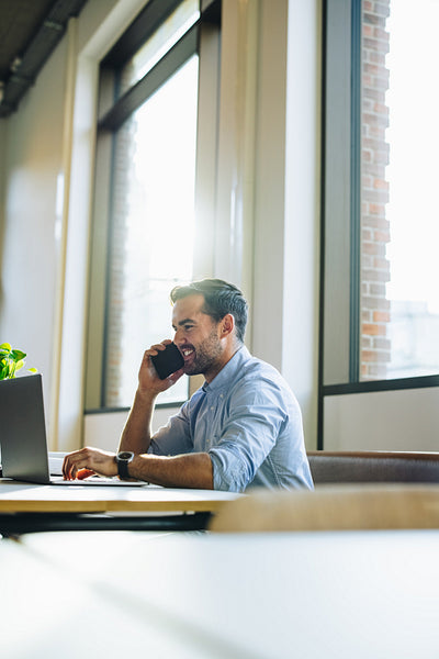 Freelancer running business from co-working office space