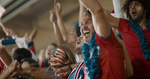 Group of USA supporters celebrating in stands