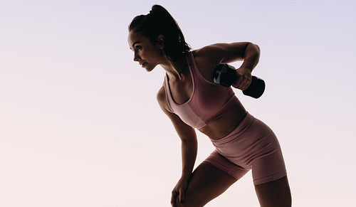 Female athlete embracing an active lifestyle with a fitness routine