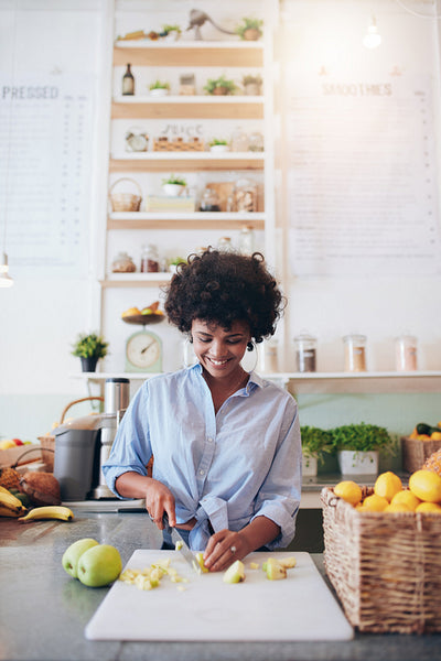 Female bartender working at juice bar