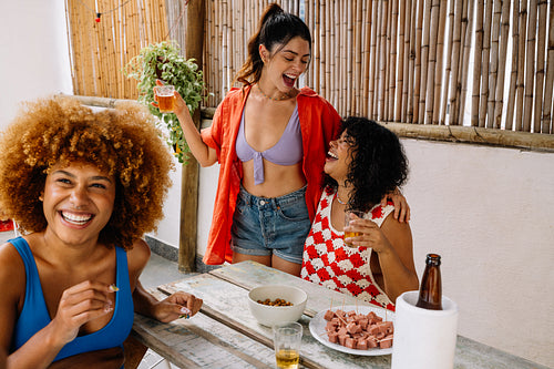 Group of Brazilian women enjoying petiscos and beer in Rio de Janeiro