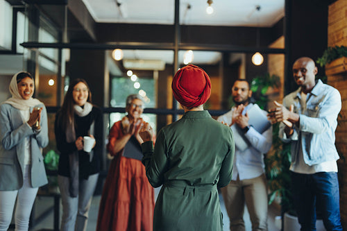 Female manager receiving an applause during a meeting