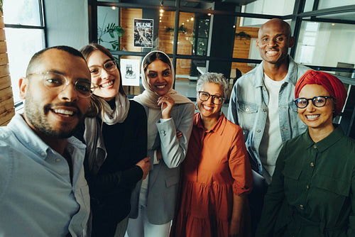 Happy business colleagues taking a selfie together