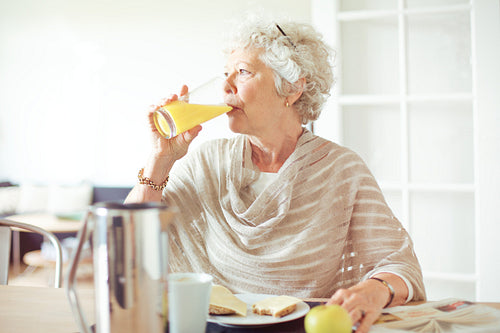 Elderly Woman Drinking Juice