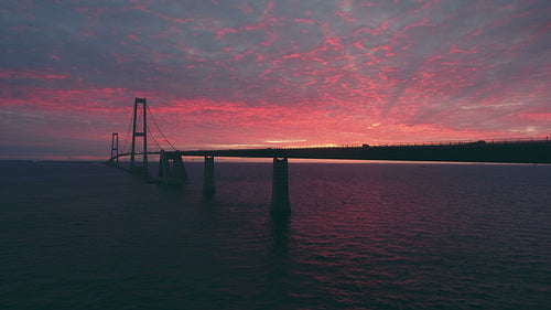 Flying by Storebaelt bridge in sea