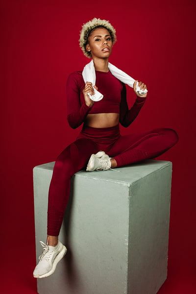 Fitness woman relaxing on workout box