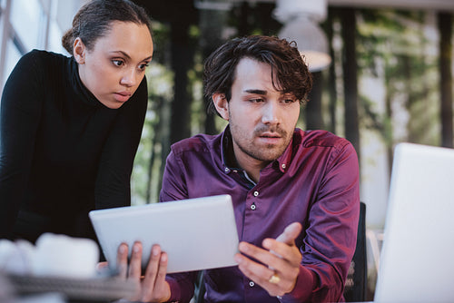 Creative executives searching information on internet