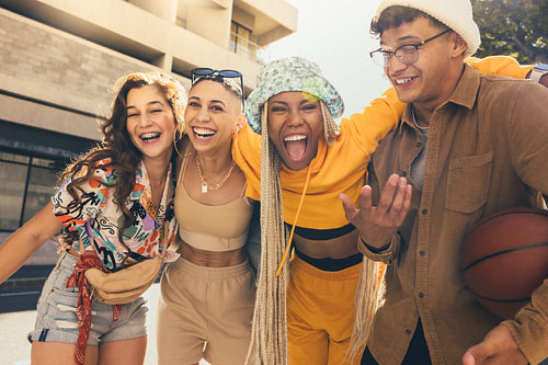 Cheerful friends having fun together in the sun
